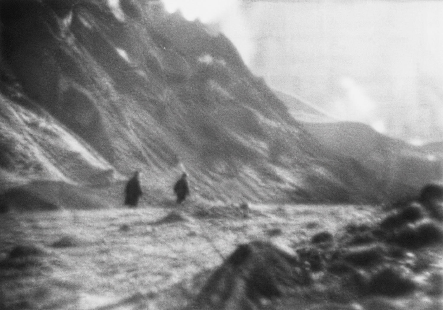 Blurred black and white photo of two alleged monks
